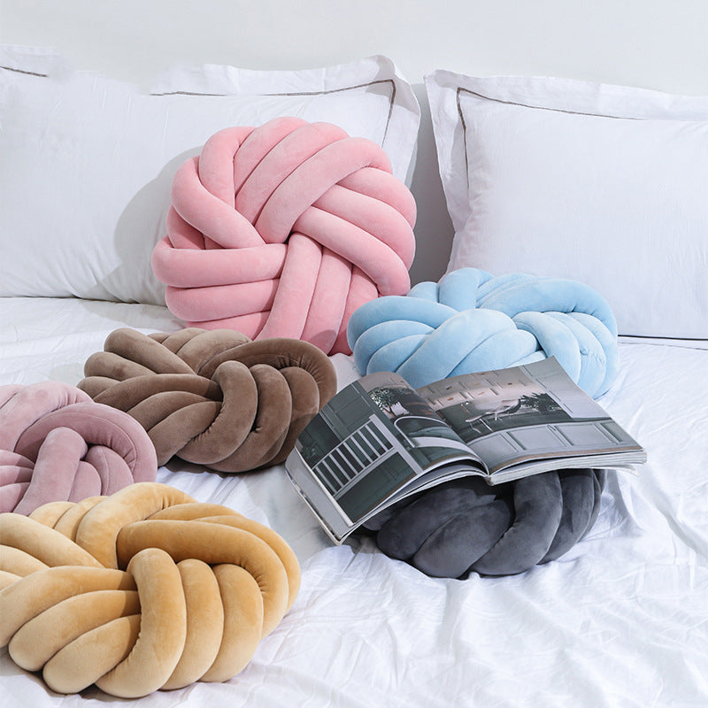 Minimalist nordic pillows and cushions styled on a neutral living room sofa